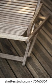 Teak Lounge Chair On A Wooden Deck