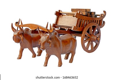Teak wood craved cow and the carts.