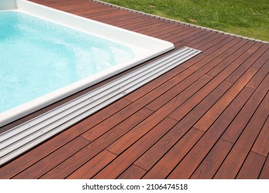 Teak Wood Pool Deck, High Quality Hardwood Decking Installed Around The Blue Swimming Pool