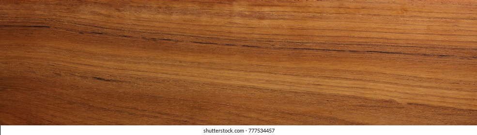 Teak wood (Tectona grandis)  wood texture, in wide format. Raw unfinished surface. Prized wood for durability and water resistance due to it's natural oils.  - Shutterstock ID 777534457