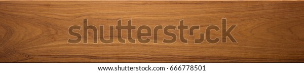 Teak wood (Tectona grandis) \
wood texture, in wide format. Raw unfinished surface. Prized wood\
for durability and water resistance due to it\'s natural oils.\
