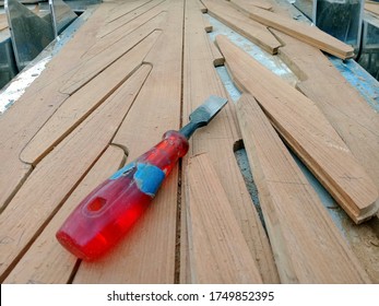 Teak Works With Tools On The Deck Of Boat