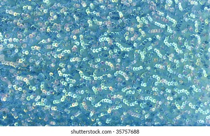 Teal Background Of Sequins And Mesh Fabric