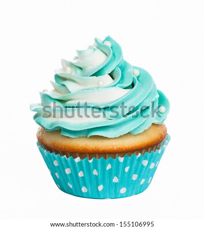 Teal birthday cupcake with butter cream icing isolated on white.