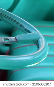 Teal Blue Leather Steering Wheel And Bucket Seat Of A Classic Vintage Car.