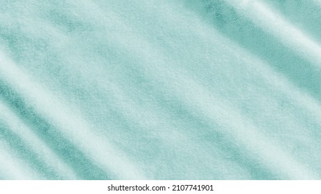 Teal blue velvet background or turquoise green velour flannel texture made of cotton or wool with soft fluffy velvety satin fabric cloth metallic color material   