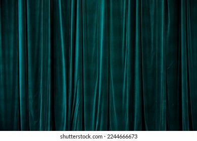 Teal curtain in theatre. Textured background