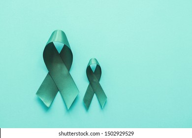 Teal Ribbons On Blue Background, Ovarian Cancer, Cervical Cancer, Anti Bullying And Sexual Assault, Pcos Awareness
