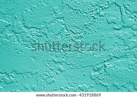 Teal or turquoise aqua mint green painted stucco wall texture background