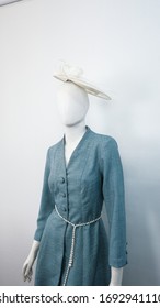 Teal Turquoise Blue Coat Dress, Kate Middleton Style Coat Dress In Teal Turquoise Color Along With Pearl White Waist Belt On A White Mannequin Shot In A Studio.