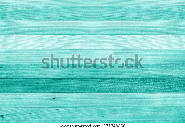 Teal\
or turquoise green painted wood background\
texture