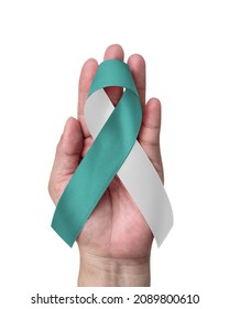 Teal And White Ribbon For Cervical Cancer Awareness Month In January And HPV Prevention, (bow On Hand Support Isolated On White Background With Clipping Path)