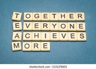 TEAM acronym (together everyone achieves more), teamwork motivation concept, word abstrat in ivory letter tiles against textured handmade paper, business and education concept - Shutterstock ID 2131378455