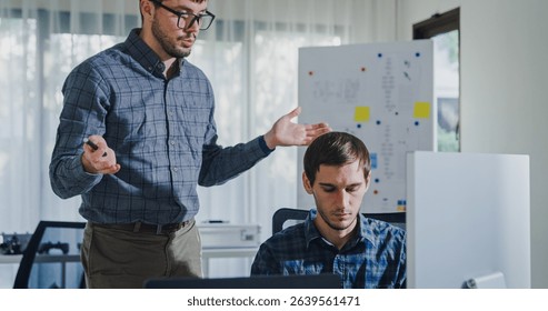 Team adult male engineer collaborate on robotic hand project using AI code solutions machine learning at tech workspace. Artificial intelligence interface, collaboration support prototype development. - Powered by Shutterstock - Get 15% off with code: PIKWIZARD15