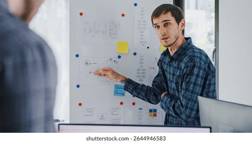 Team adult male engineer develop present AI robotics hand project at tech workspace. Artificial intelligence, collaboration support prototype development, robotic, debugging, machine learn, training.