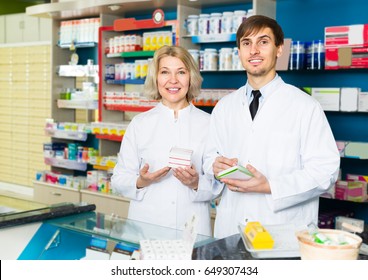 Team Of Adults Working In Chemist Warehouse Indoors
