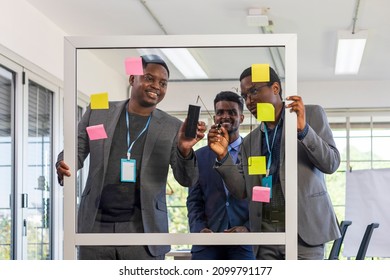 Team of African American executive worker is brainstorming on current financial trend while using writing board to explain to each other for diversity business - Shutterstock ID 2099791177