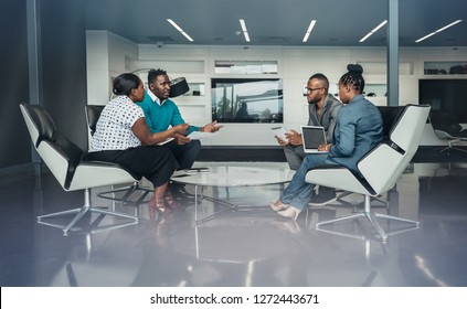 Team Of African Bussines People Sitting In A Modern Office And Talking During An Work Meeting