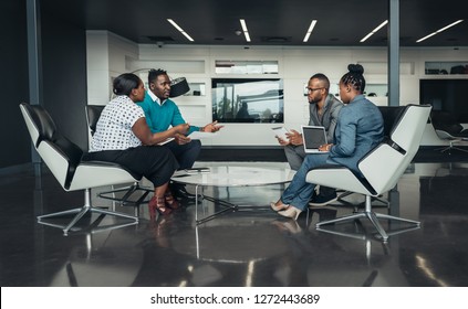 Team Of African Bussines People Sitting In A Modern Office And Talking During An Work Meeting