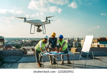 Team of architects people in group on construciton site check documents and business workflow - Shutterstock ID 2232833951