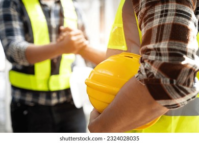 Team architects workers hands to join forces to join forces to work for the industry for success. Teamwork and professional colleagues : Workers' hands, teamwork concept. - Shutterstock ID 2324028035