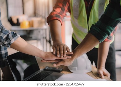 Team architects workers, men and women, join hands to join forces to join forces to work for the industry for success. Teamwork and professional colleagues : Workers' hands, teamwork concept. - Shutterstock ID 2254715479
