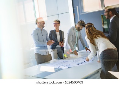 Team of architects working on construction plans