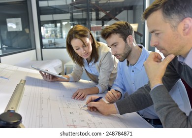 Team of architects working on construction project