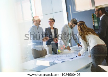 Team of architects working on construction plans