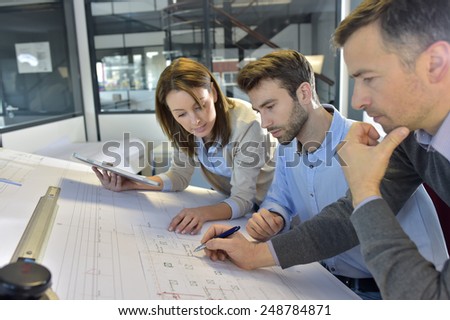 Team of architects working on construction project