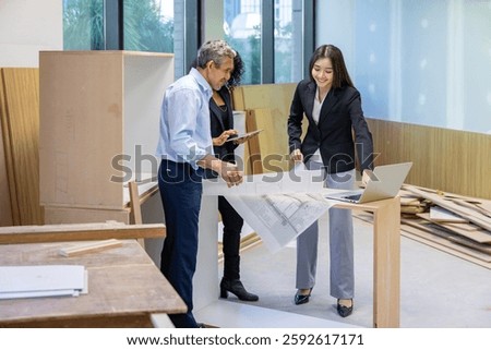 Team of architectures, engineer, interior designer and businessmen discussing and brainstorming on floor plan modification for real estate renovating investment and housing development project concept