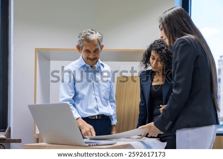 Team of architectures, engineer, interior designer and businessmen discussing and brainstorming on floor plan modification for real estate renovating investment and housing development project concept