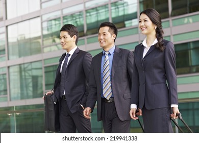 Team Of Asian Business People With Modern Building Background.