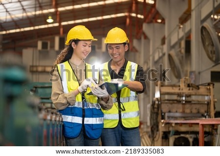 Team Asian engineer working control machine in factory. Group people Asia Worker control machine with manufacturing of industry.