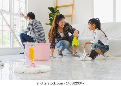 Team Asian Family Cleaning House Or New Apartment Together And Having Fun. Moving And Start Up, Cleaning House, Residence, Living, Health Concept