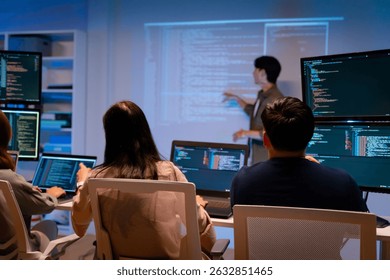 Team Asian software engineer or programmer team working late in development office,problem solving or algorithm of ai assistant helping for work.software developer,digital technology security concept