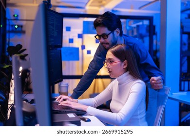 Team Asian software engineer or programmer team working late in development office,problem solving or algorithm of ai assistant helping for work.software developer,digital technology security concept