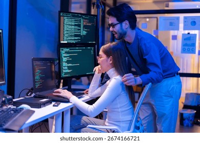 Team Asian software engineer or programmer team working late in development office,problem solving or algorithm of ai assistant helping for work.software developer,digital technology security concept