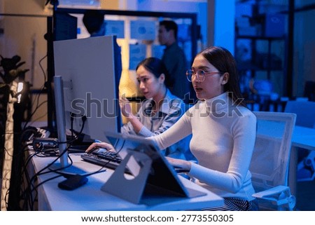Team Asian software engineer or programmer team working late in development office,problem solving or algorithm of ai assistant helping for work.software developer,digital technology security concept