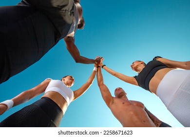 A team of athletes with athletic body in the summer outdoors go in for sports, jogging and running. Download a photo to advertise on social networks, sports running magazines and fitness websites.
