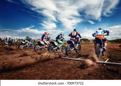 Team Athletes On Mountain Bikes Start. Concept Motorcross Stunts, Bike. 