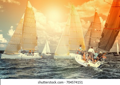 Team Athletes Participating In The Sailing Competition - Yacht Race, Regatta. Sailboats. Recreational Water Sports, Extreme Sport Action. Healthy Active Lifestyle. Summer Fun Adventure.