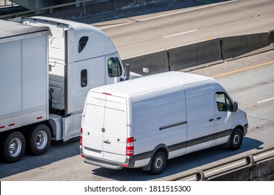 Team Of Big Rig Semi Truck With Dry Van Semi Trailer And Compact Cargo Mini Van Driving Side By Side On The Multiline Highway Road Working Hard Together For Timely Delivery