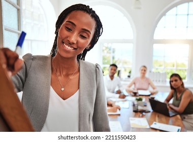 Team, Black Woman And Brainstorming Writing On Board For Team Meeting, Idea Or Smile For Planning Or Strategy In Office. Group, Teamwork Or Creative Conversation, Talk Or Discuss Project In Workspace