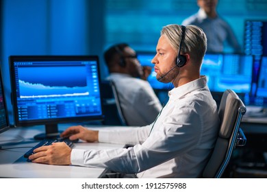 Team Of Brokers Is Working In Office Using Workstation And Analysis Technology. Workplace Of Professional Traders. Global Financial Markets, Business, Currency Exchange And Banking Concepts.