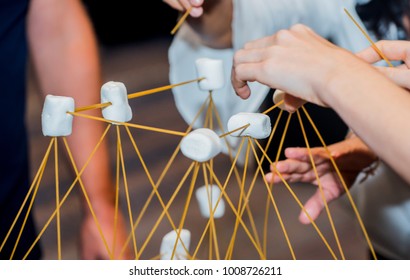Team building activities, use marshmallow and wood for house design. Personal development for business. - Shutterstock ID 1008726211