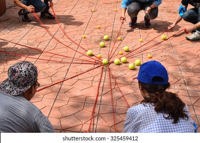 Team Building Activity, Tennis Balls And Table Tennis Balls With Rope In Harmonize Activity