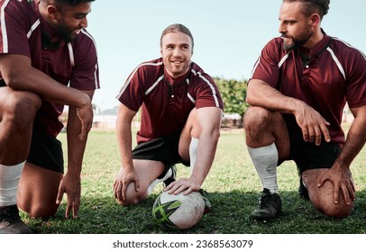 Team building, huddle and rugby players on a field planning a strategy for a game, match or tournament. Sports, fitness and captain talking to group at training or practice on an outdoor pitch. - Powered by Shutterstock