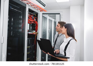 Team Of Busienss People Working In Server Room