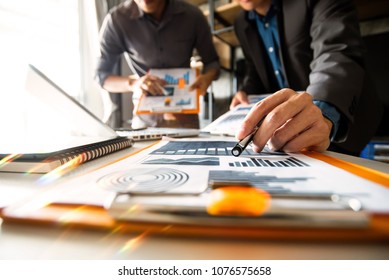 Team business meeting presentation. Hand businessman working   project in modern office.Laptop computer and tablet and smart phone on white desk in morning light
 - Shutterstock ID 1076575658
